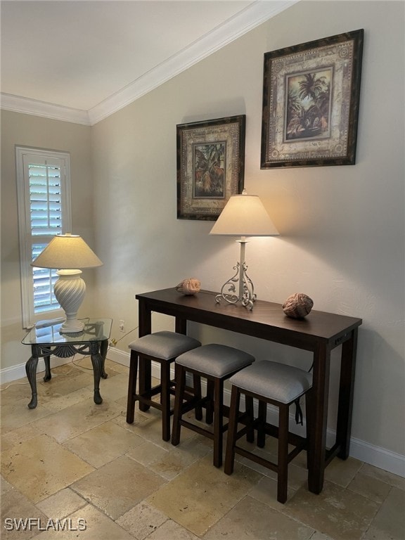 dining area with crown molding