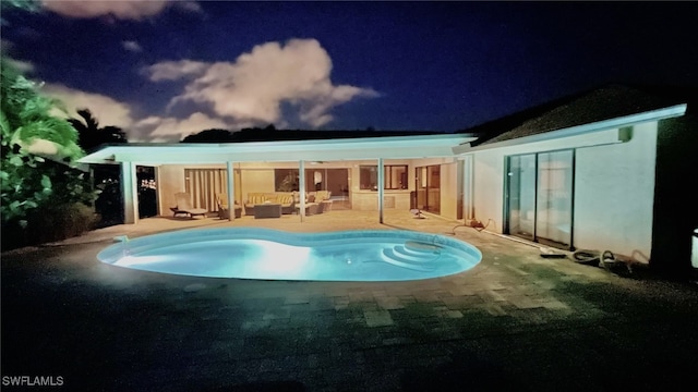 view of swimming pool with a patio area and outdoor lounge area