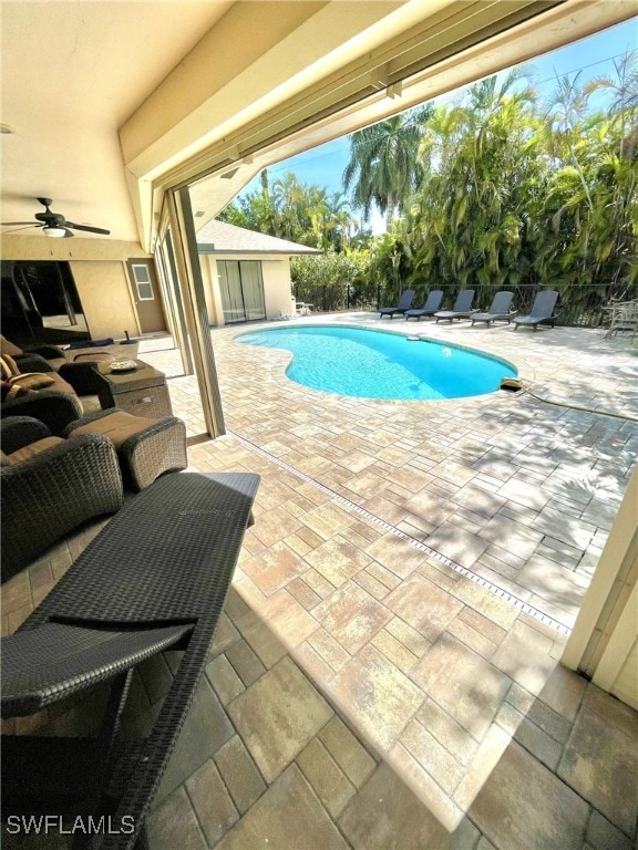 view of swimming pool featuring an outdoor hangout area, ceiling fan, and a patio area