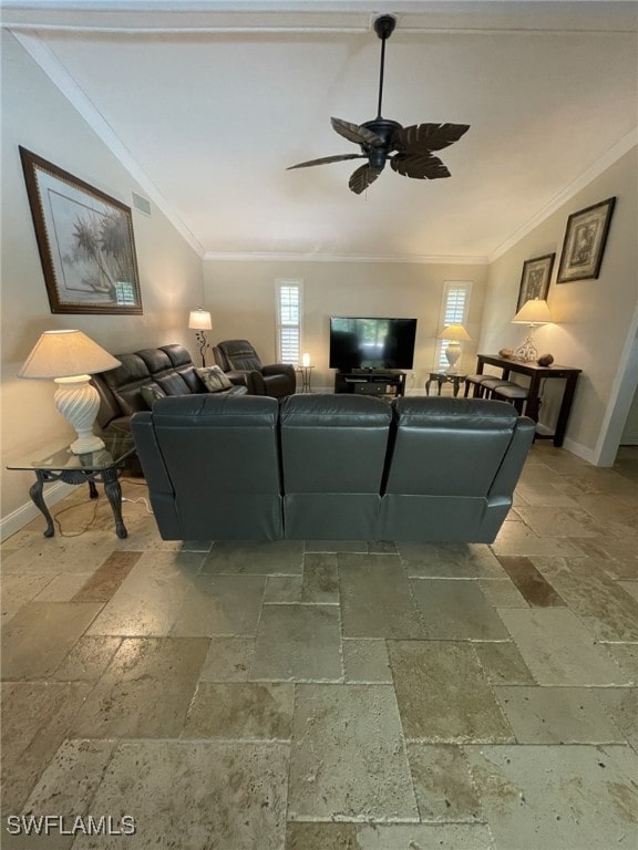 living room with ceiling fan, ornamental molding, and vaulted ceiling