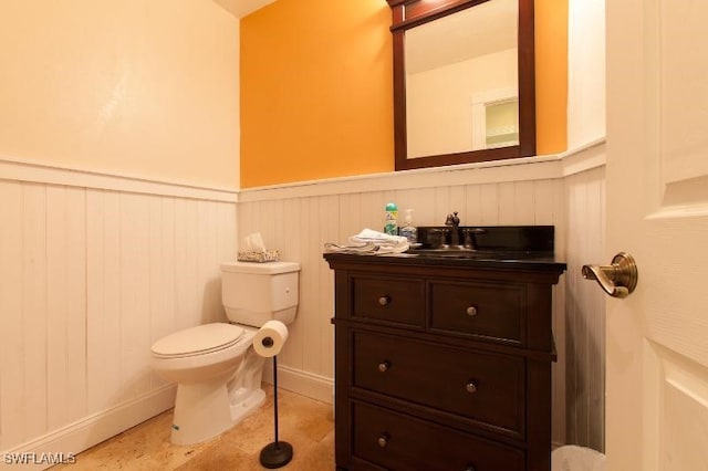 bathroom with vanity, tile patterned floors, and toilet