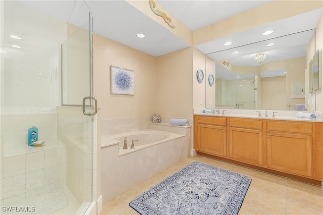 bathroom featuring vanity, shower with separate bathtub, and tile patterned flooring