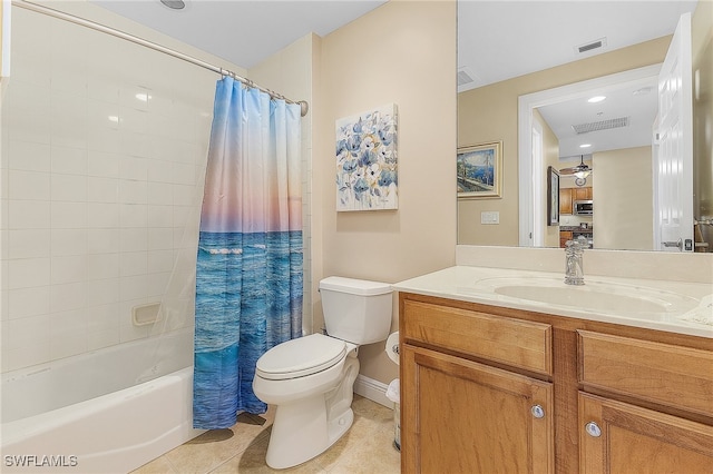 full bathroom featuring shower / bath combo with shower curtain, tile patterned floors, toilet, and vanity