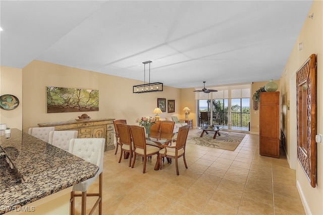 tiled dining area featuring ceiling fan