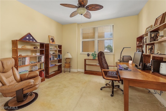 carpeted office with ceiling fan