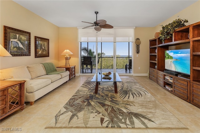 tiled living room featuring ceiling fan