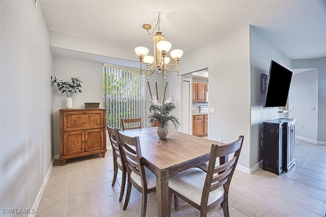 tiled dining area with a notable chandelier