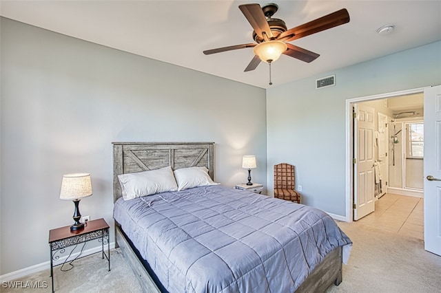 bedroom with light carpet and ceiling fan