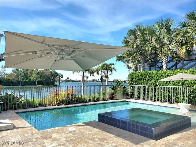 view of pool featuring an in ground hot tub, a water view, a fenced backyard, and a fenced in pool