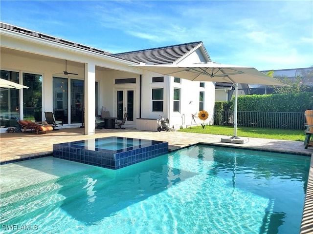 view of pool with a patio, french doors, fence, and a ceiling fan