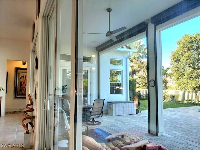 doorway with a ceiling fan