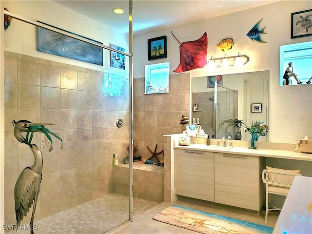 full bath with walk in shower and vanity