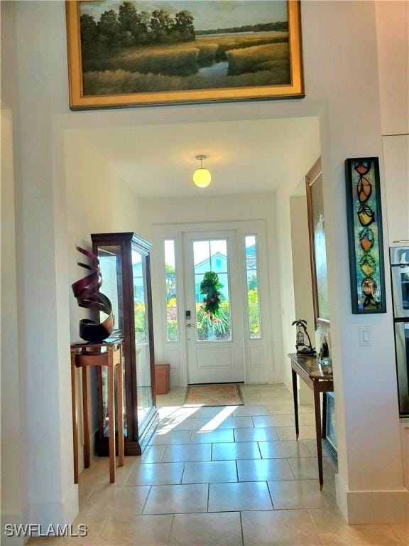 entryway featuring light tile patterned floors