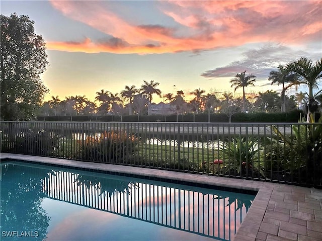 view of swimming pool with fence and a fenced in pool