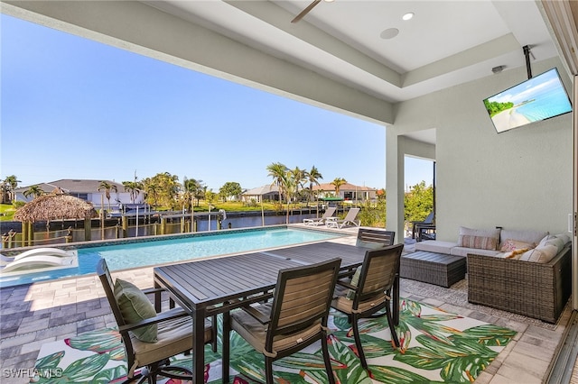 view of swimming pool with an outdoor living space and a patio