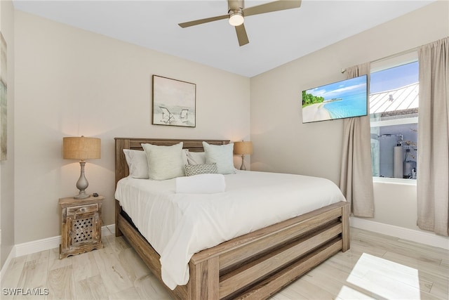 bedroom featuring ceiling fan and light hardwood / wood-style flooring