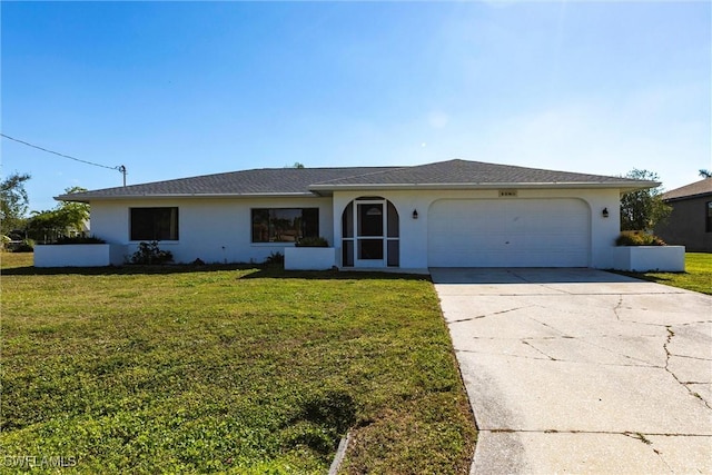 single story home featuring a garage and a front lawn