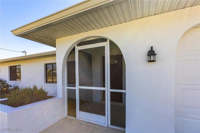 118 SW 13th St, Cape Coral, FL 33991 - view of exterior entry featuring stucco siding