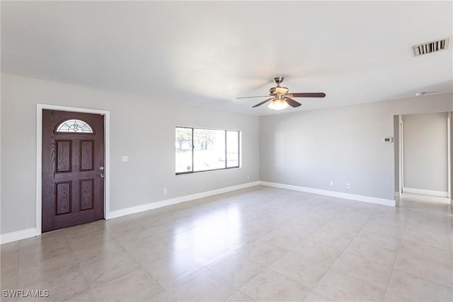 entrance foyer with ceiling fan