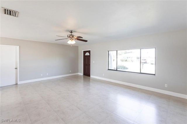 spare room with ceiling fan