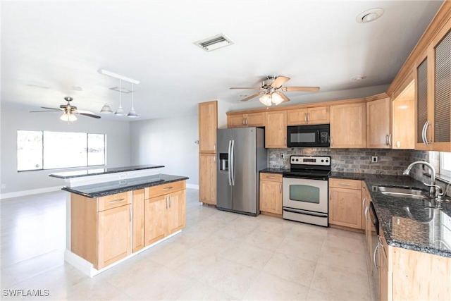 118 SW 13th St, Cape Coral, FL 33991 - kitchen with appliances with stainless steel finishes, ceiling fan, tasteful backsplash, light brown cabinetry, and a kitchen island