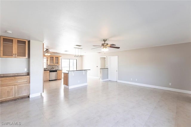 unfurnished living room with ceiling fan