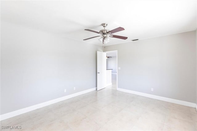 spare room with ceiling fan