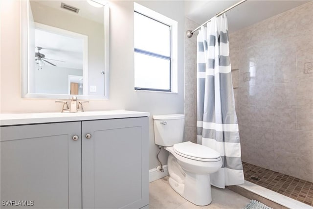 118 SW 13th St, Cape Coral, FL 33991 - full bathroom with a tile shower, vanity, a ceiling fan, and tile patterned floors