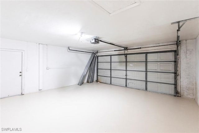 118 SW 13th St, Cape Coral, FL 33991 - garage featuring a garage door opener
