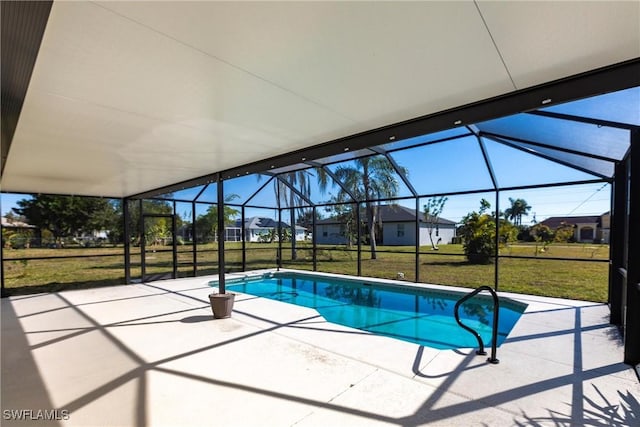 view of pool with a lanai, a patio, and a lawn