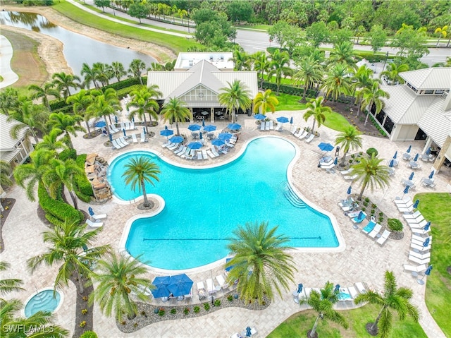 7045 Live Oak Dr, Naples, FL 34114 - community pool with a patio and a water view