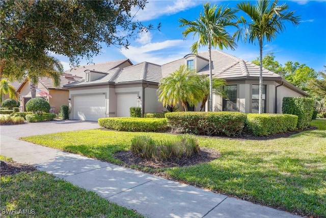 7045 Live Oak Dr, Naples, FL 34114 - view of front of home featuring stucco siding, driveway, a tile roof, and a front yard
