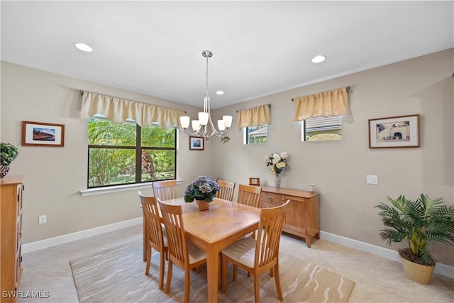 dining area featuring a notable chandelier and a healthy amount of sunlight