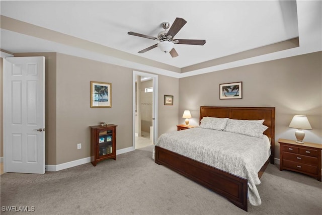 carpeted bedroom with ceiling fan and ensuite bathroom