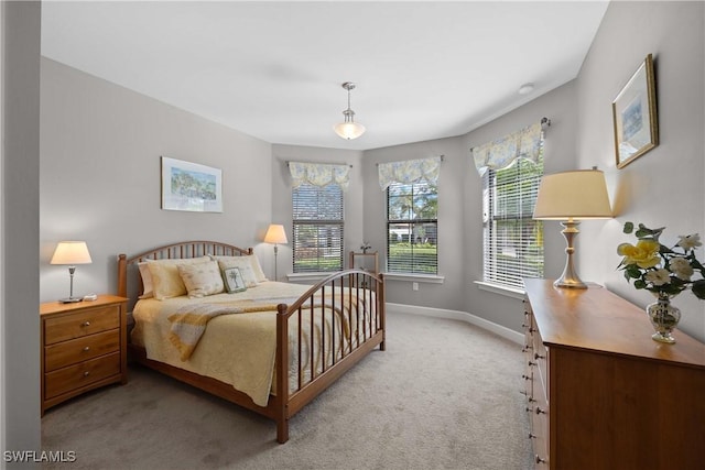 bedroom with light colored carpet