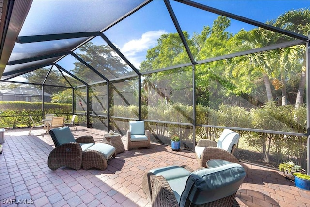 view of patio / terrace featuring glass enclosure