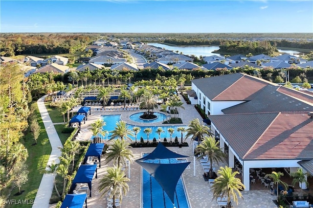 birds eye view of property with a water view