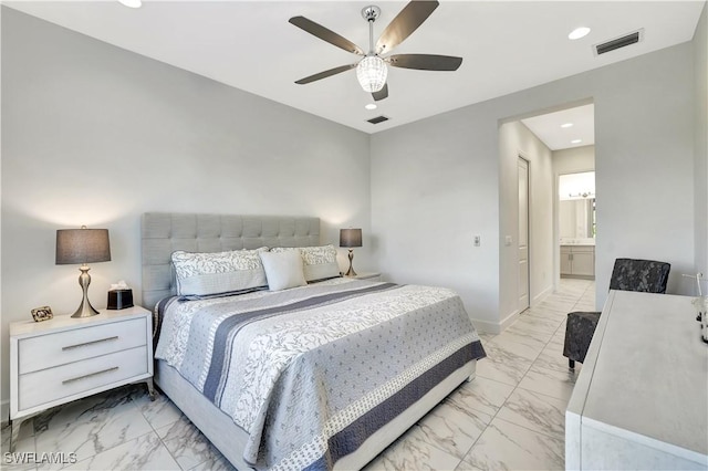 bedroom with ceiling fan and ensuite bath