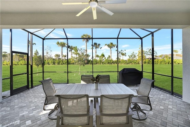 sunroom / solarium with ceiling fan