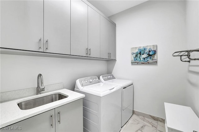 laundry area with cabinets, sink, and independent washer and dryer