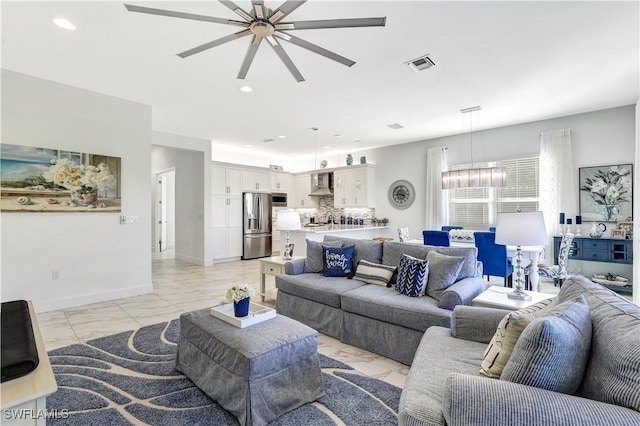 living room featuring ceiling fan