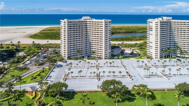 bird's eye view featuring a beach view and a water view