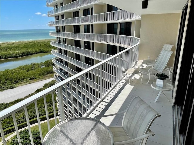 balcony featuring a water view