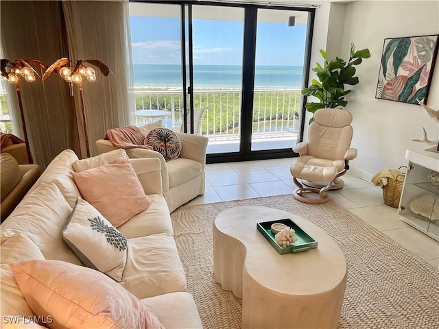 tiled living room with a water view