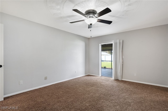 carpeted empty room featuring ceiling fan