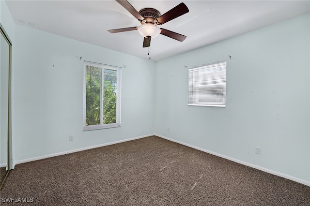 empty room with carpet and ceiling fan