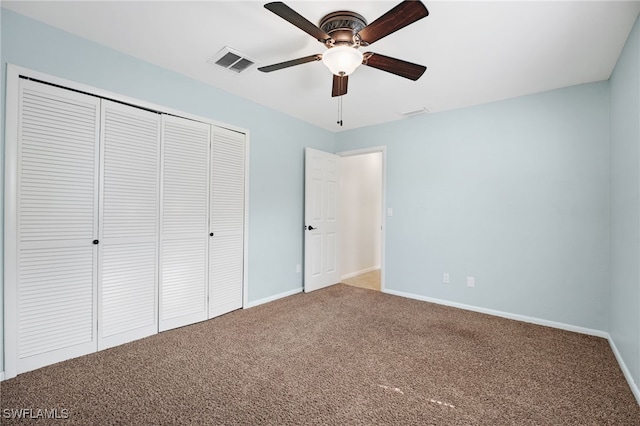 unfurnished bedroom with carpet floors, a closet, and ceiling fan