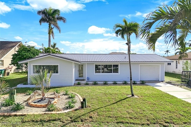 ranch-style house with a garage and a front yard