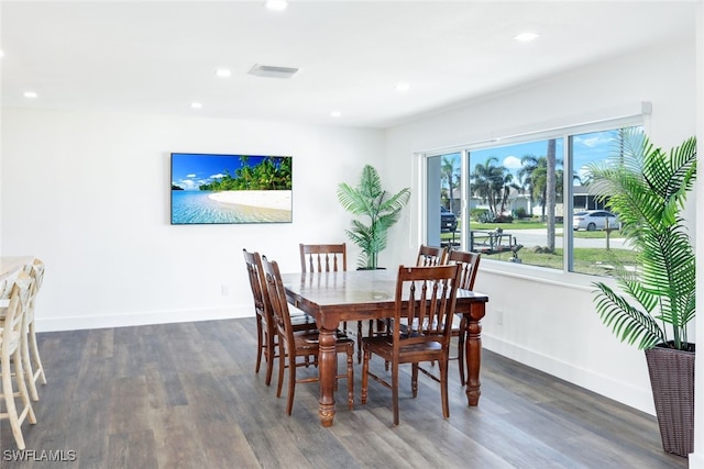 dining space featuring dark hardwood / wood-style flooring