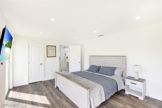 bedroom with dark hardwood / wood-style floors